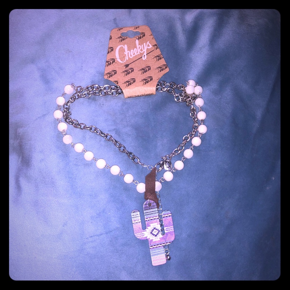 Cheeky’s brand necklace with Ivory beads